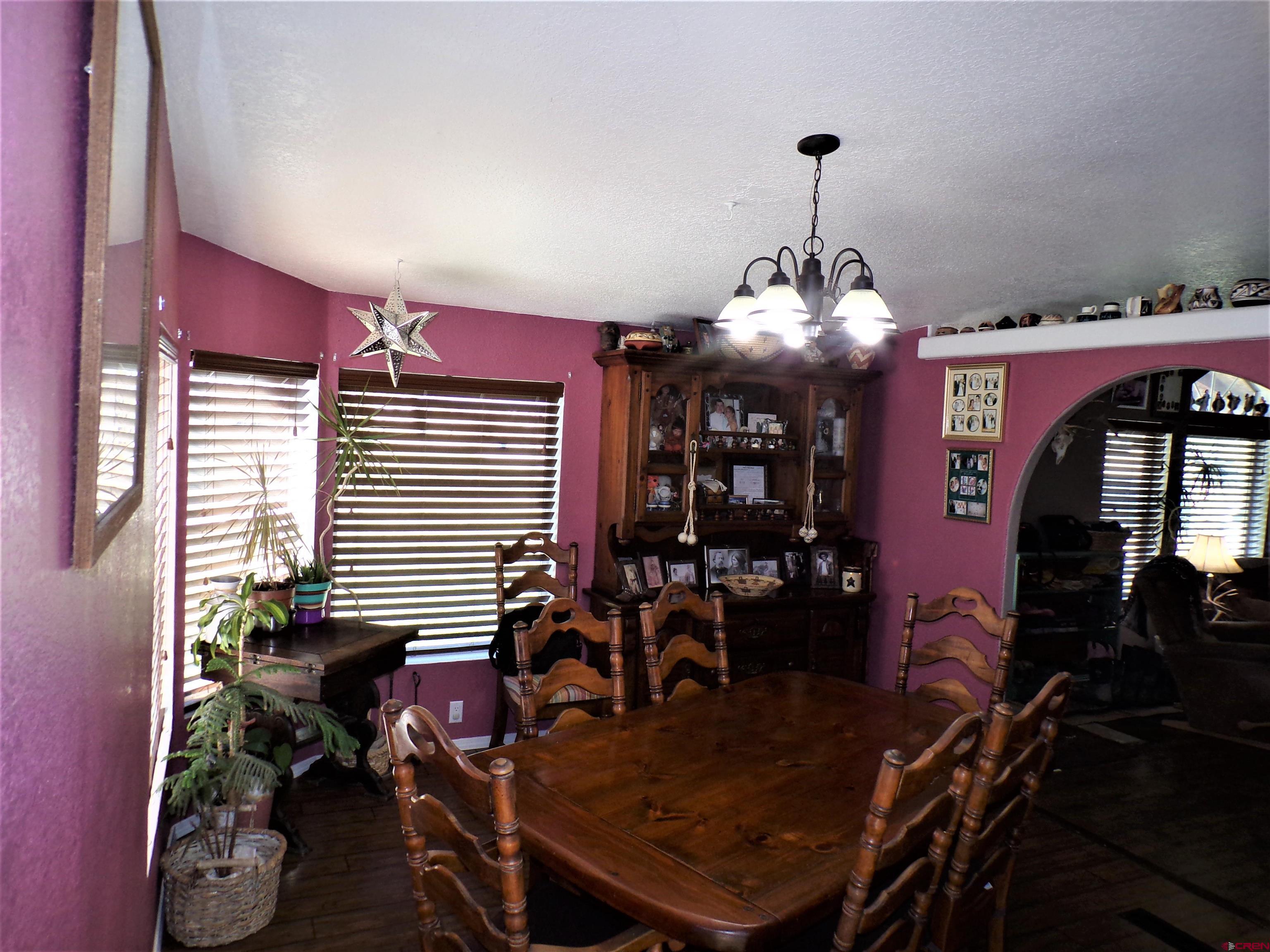 24085 Rd North Cortez, CO 81321 - Photo 9 of 34 a dining room with furniture and window