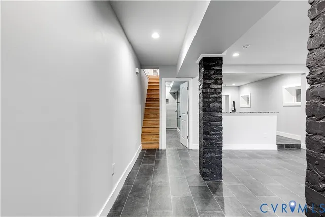 a view of a hallway with a kitchen