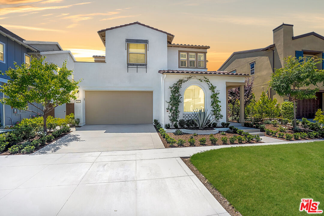 17 Lustre Street Rancho Mission Viejo, CA 92694 - Photo 1 of 63 a front view of a house with a garden and plants