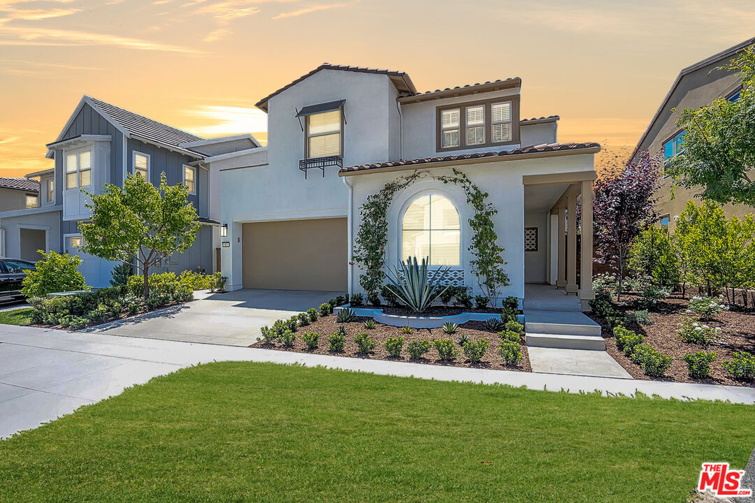 17 Lustre Street Rancho Mission Viejo, CA 92694 - Photo 2 of 63 a front view of a house with a garden and plants