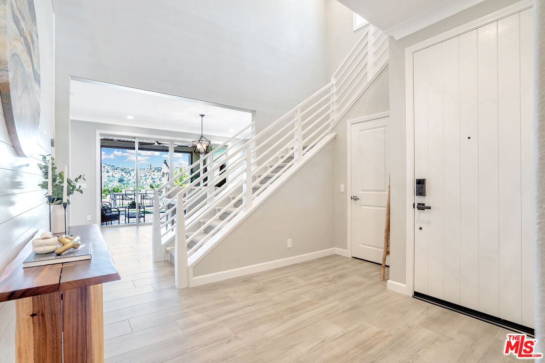 17 Lustre Street Rancho Mission Viejo, CA 92694 - Photo 24 of 63 a view of entryway and hall with wooden floor