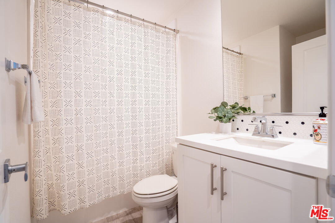 17 Lustre Street Rancho Mission Viejo, CA 92694 - Photo 28 of 63 a bathroom with a sink a toilet and a mirror