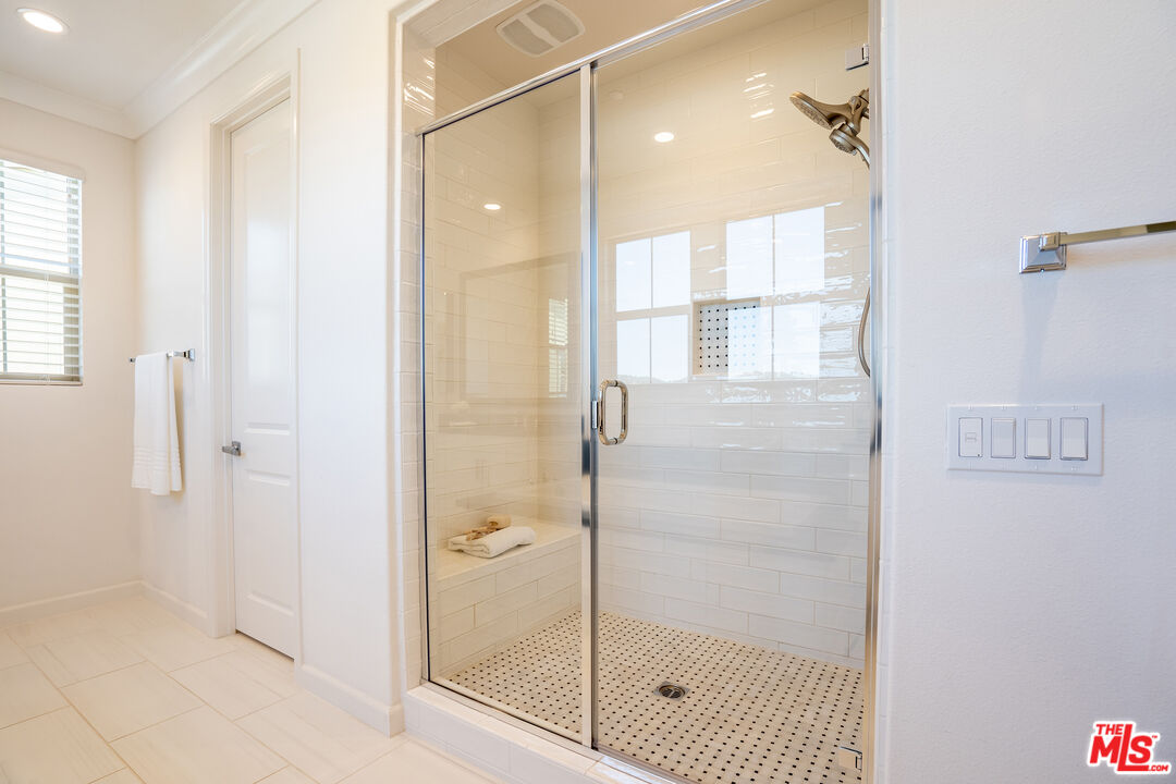 17 Lustre Street Rancho Mission Viejo, CA 92694 - Photo 35 of 63 a bathroom with a glass shower door