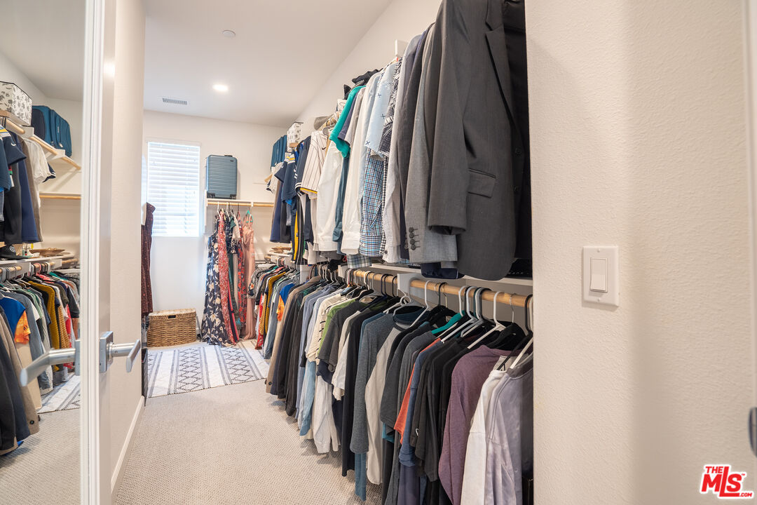17 Lustre Street Rancho Mission Viejo, CA 92694 - Photo 36 of 63 a view of walk in closet with clothes