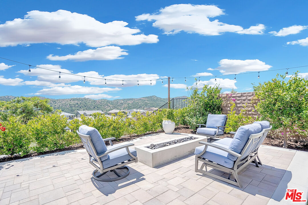 17 Lustre Street Rancho Mission Viejo, CA 92694 - Photo 43 of 63 a view of a patio with couches table and chairs and potted plants