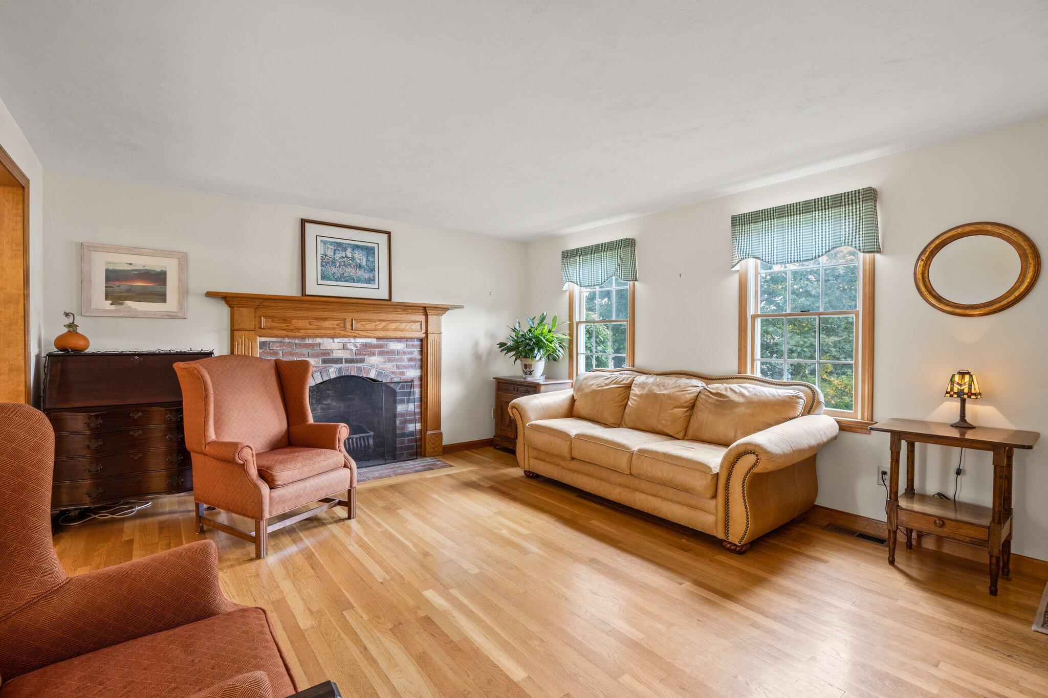 31 Hillside Road Harwich, MA 02645 - Photo 12 of 35 a living room with furniture and a fireplace