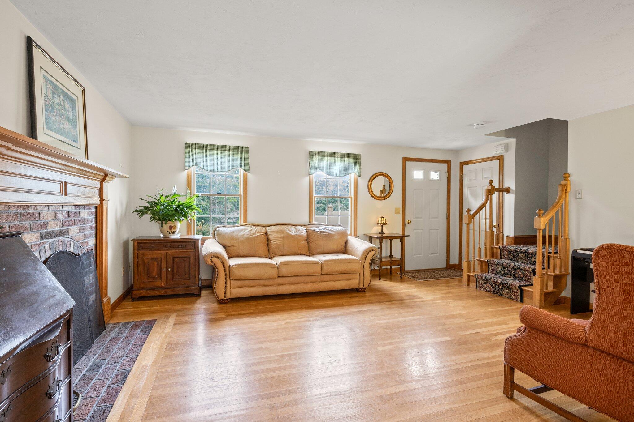 31 Hillside Road Harwich, MA 02645 - Photo 13 of 35 a living room with furniture and a fireplace