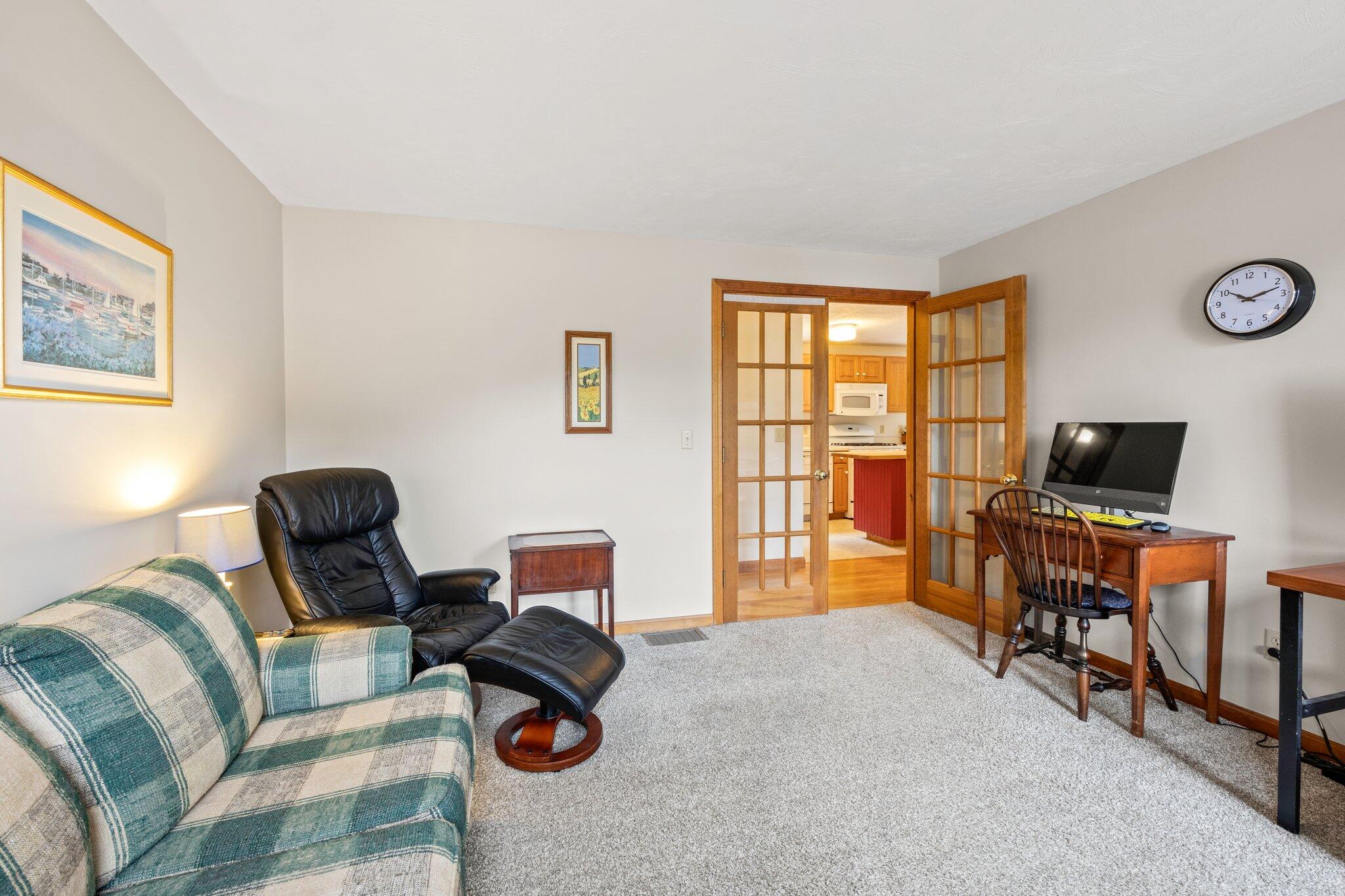 31 Hillside Road Harwich, MA 02645 - Photo 14 of 35 a living room with furniture and a flat screen tv