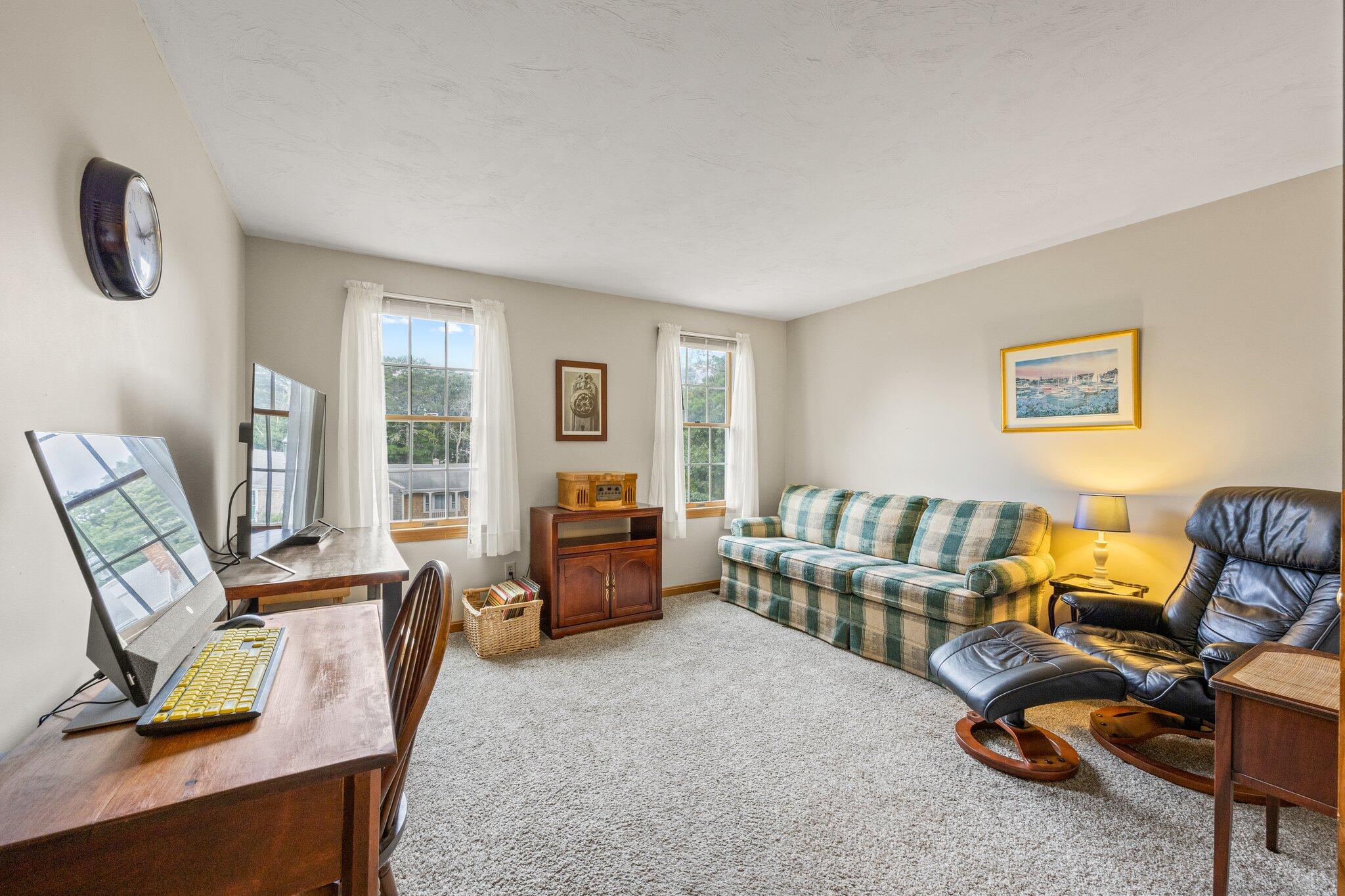 31 Hillside Road Harwich, MA 02645 - Photo 15 of 35 a living room with furniture and a flat screen tv