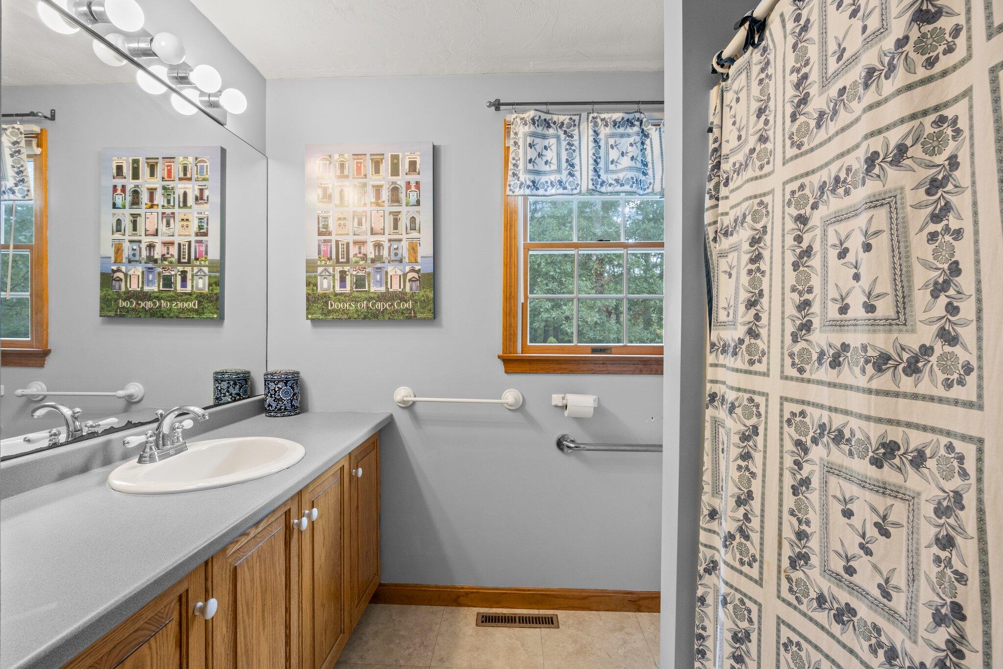 31 Hillside Road Harwich, MA 02645 - Photo 17 of 35 a bathroom with a sink and a mirror