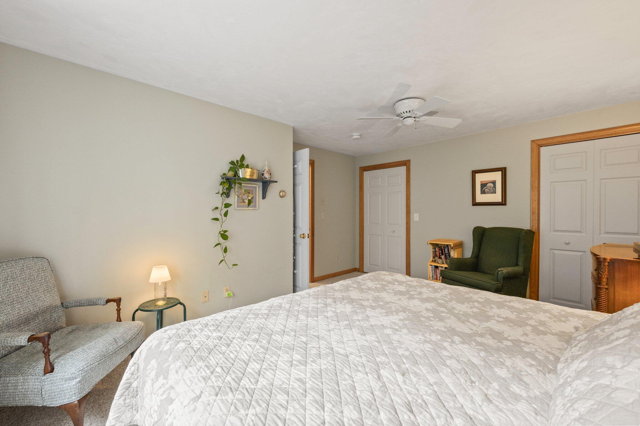 31 Hillside Road Harwich, MA 02645 - Photo 19 of 35 a bedroom with a bed and a lamp