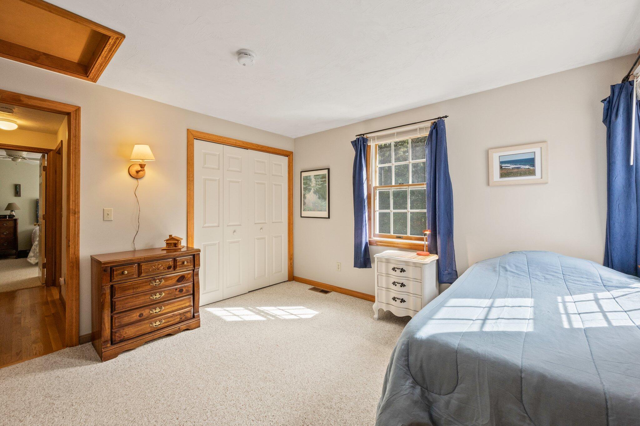 31 Hillside Road Harwich, MA 02645 - Photo 24 of 35 a bedroom with a bed and wooden floor