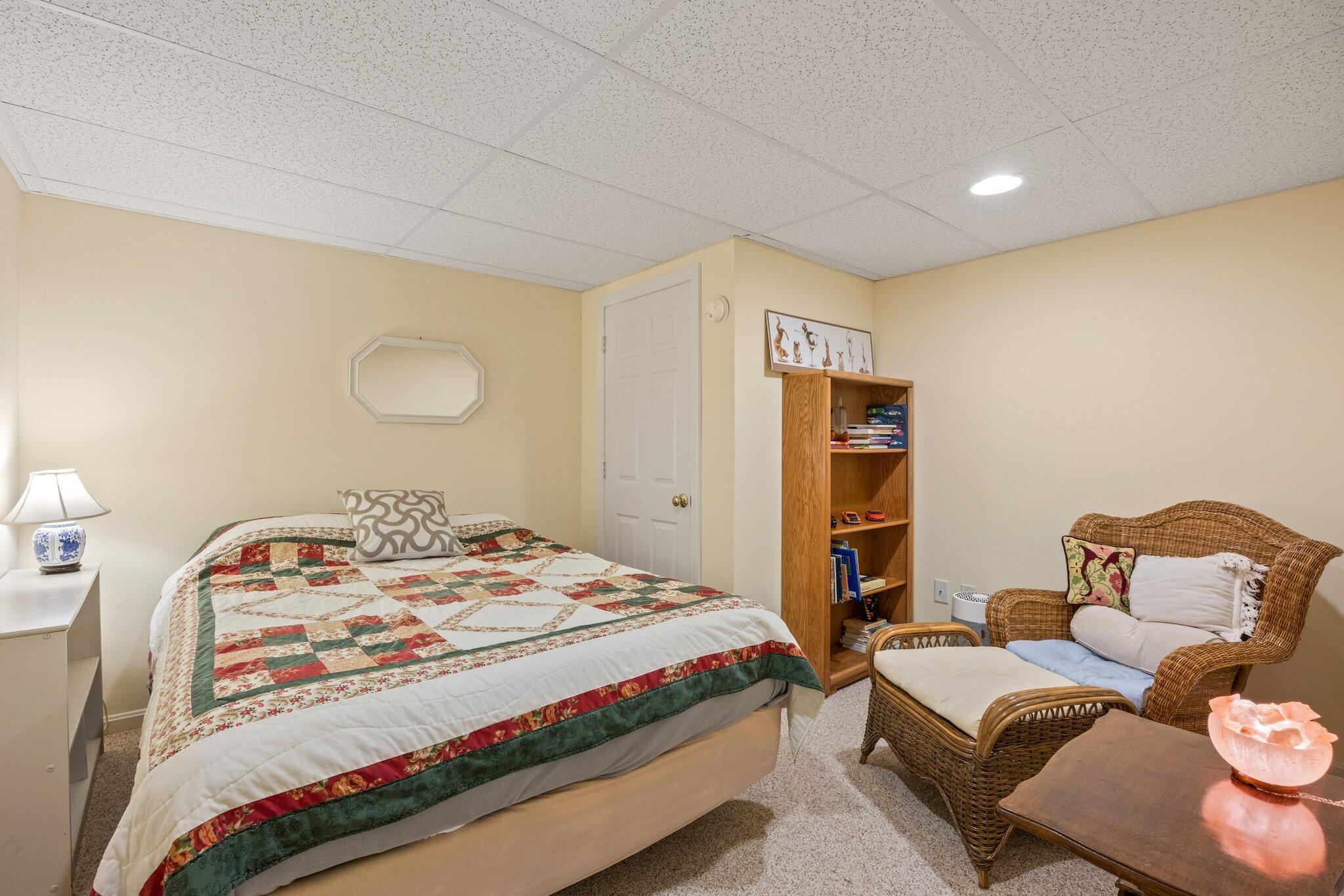 31 Hillside Road Harwich, MA 02645 - Photo 26 of 35 a bedroom with a bed and wooden floor