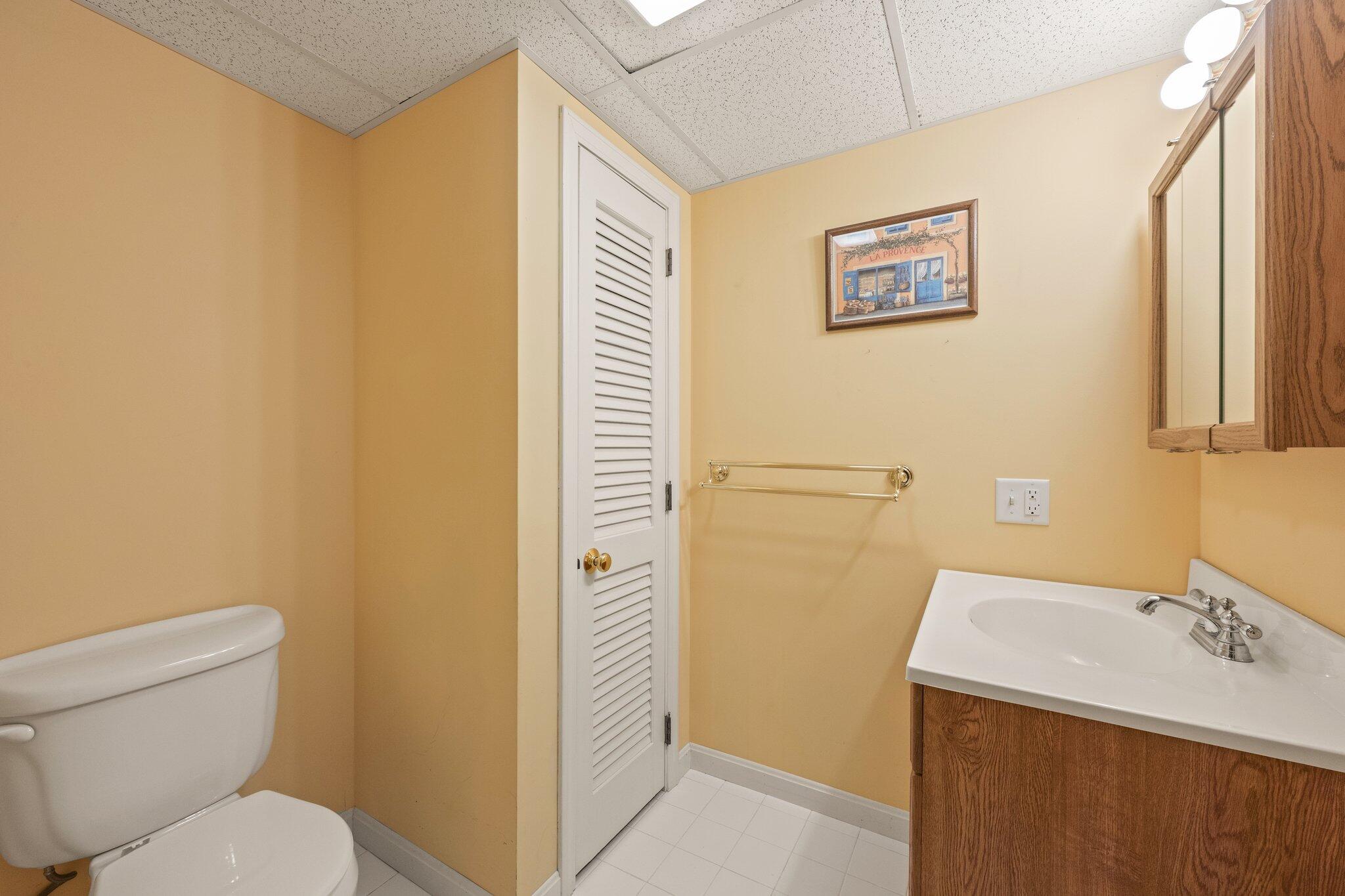 31 Hillside Road Harwich, MA 02645 - Photo 27 of 35 a bathroom with a sink a toilet and a mirror