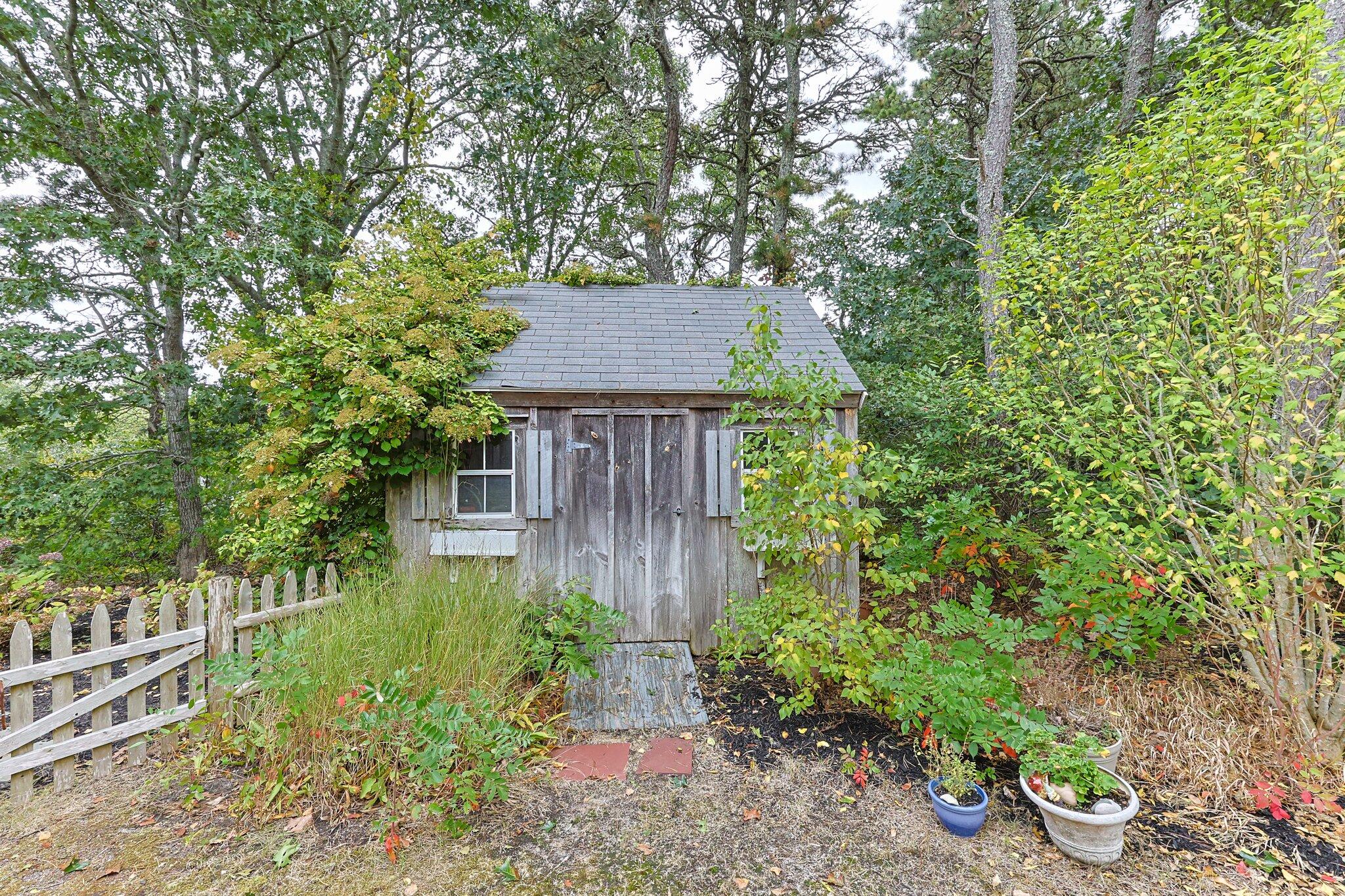 31 Hillside Road Harwich, MA 02645 - Photo 31 of 35 a view of a house with a yard and plants
