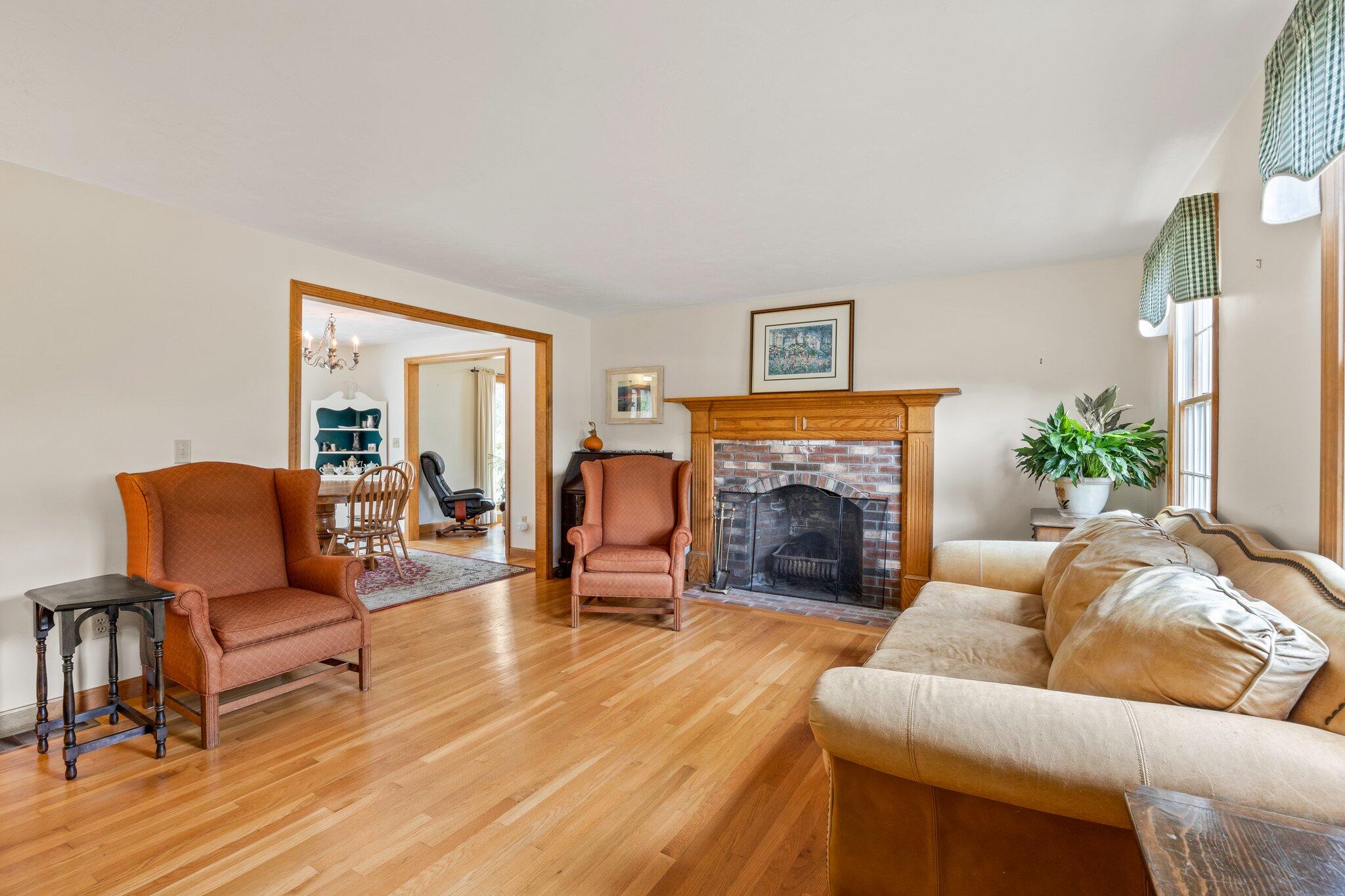 31 Hillside Road Harwich, MA 02645 - Photo 4 of 35 a living room with furniture and a fireplace