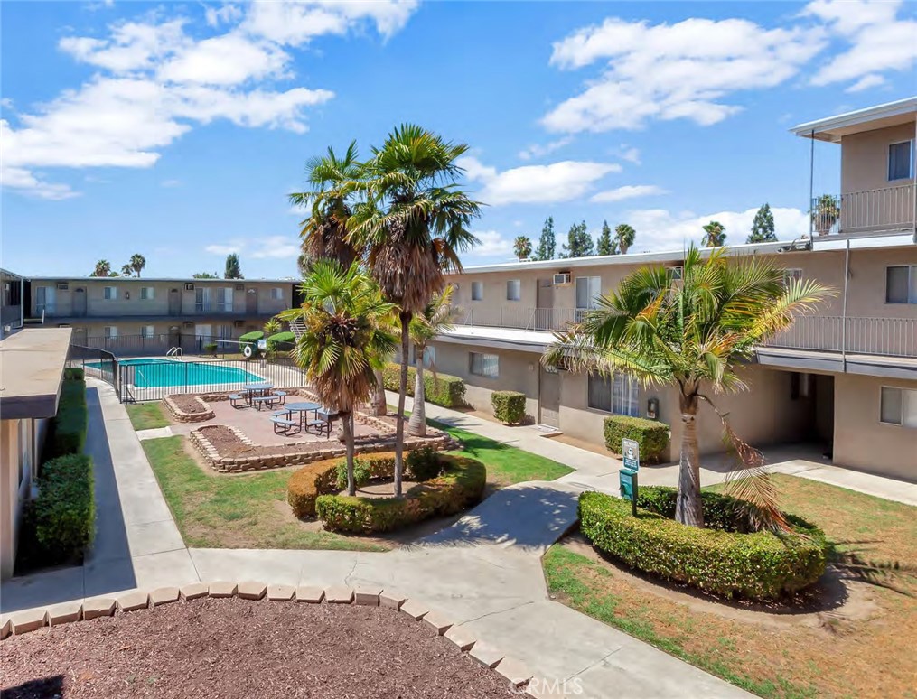 3681 Cranford Avenue Riverside, CA 92507 - Photo 7 of 8 a front view of a house with a garden and tree