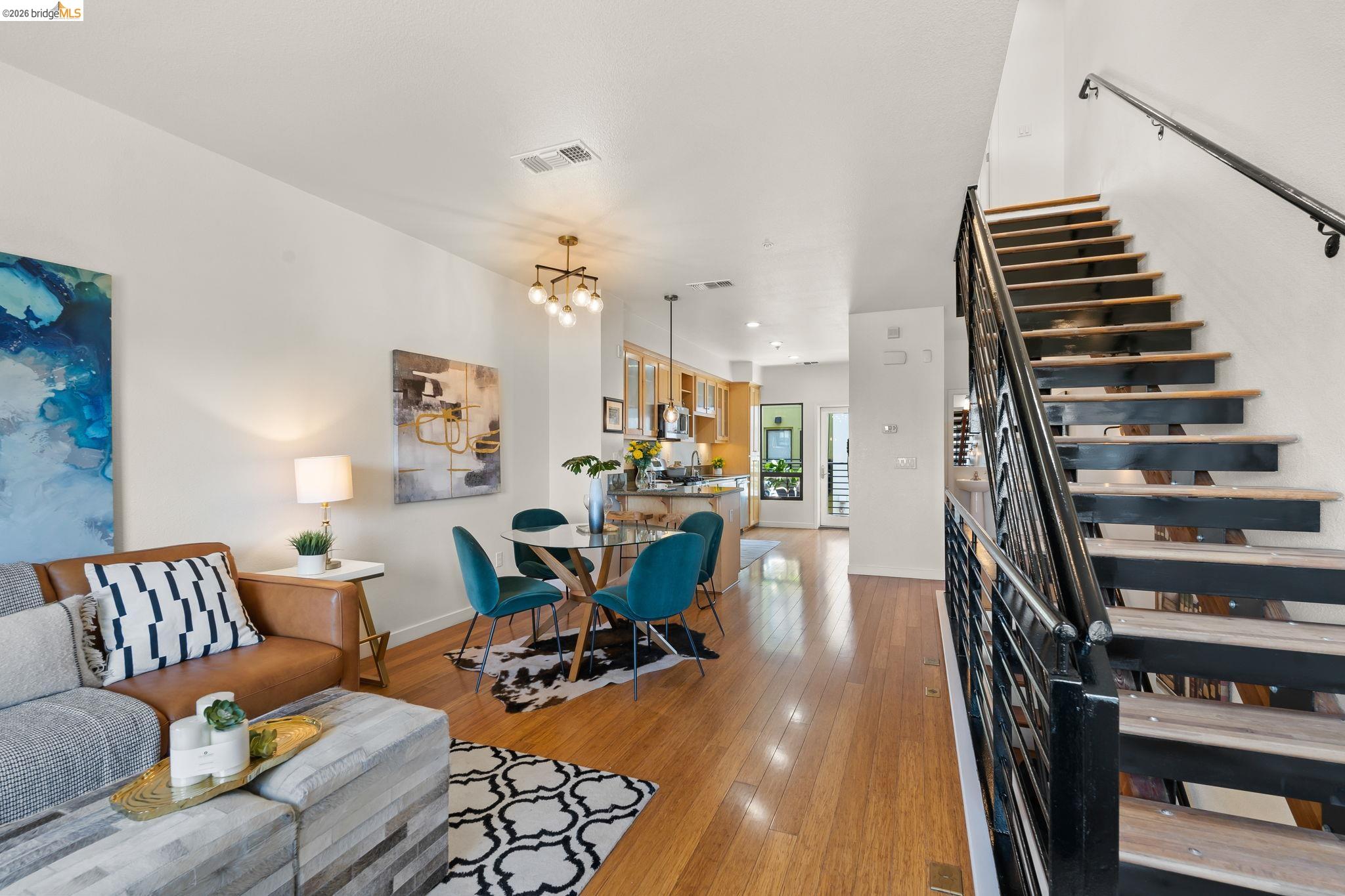 1780 12th Street Oakland, CA 94607 - Photo 14 of 31 a living room with furniture and wooden floor