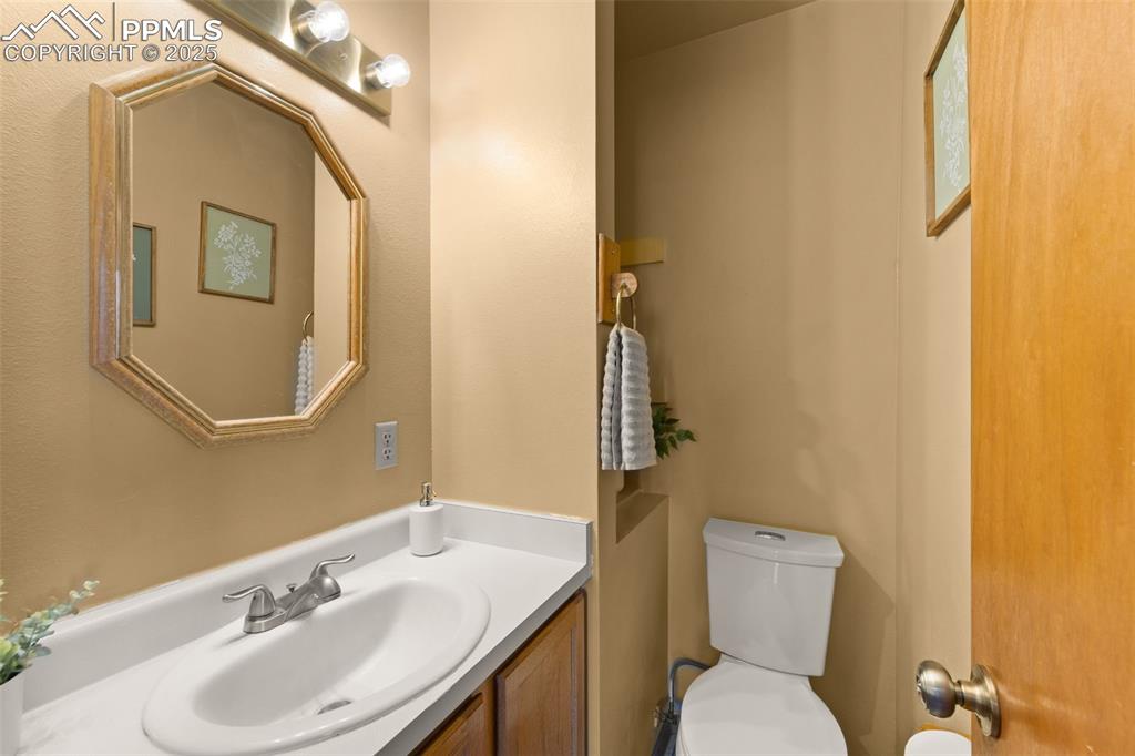 428 Ridge Drive Divide, CO 80814 - Photo 20 of 49 a bathroom with a toilet sink and mirror