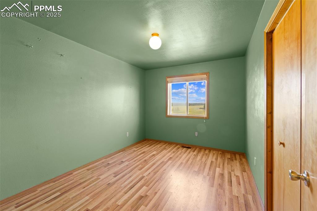428 Ridge Drive Divide, CO 80814 - Photo 26 of 49 a view of empty room with wooden floor