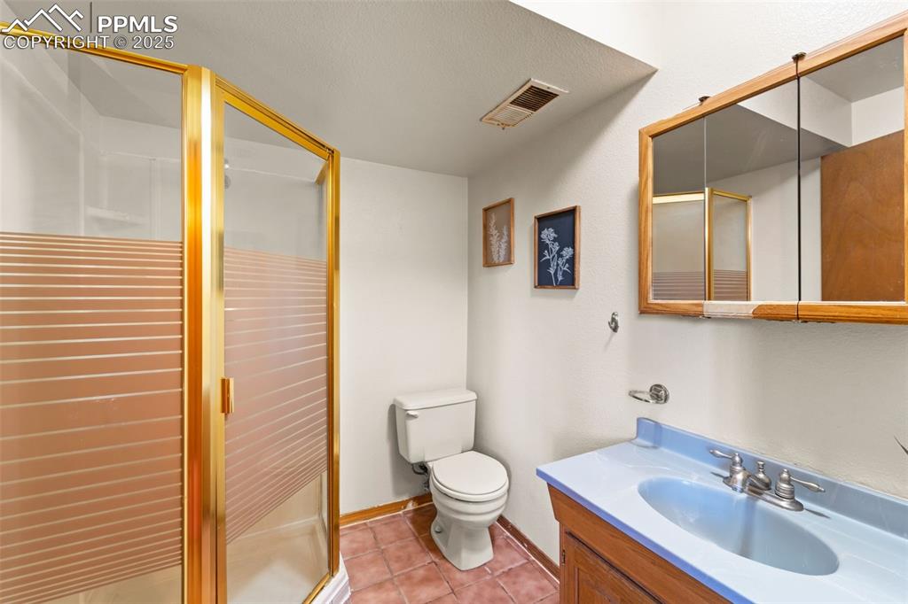 428 Ridge Drive Divide, CO 80814 - Photo 33 of 49 a bathroom with a sink a toilet and shower
