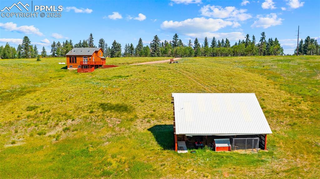 428 Ridge Drive Divide, CO 80814 - Photo 37 of 49 a view of a swimming pool with an outdoor space and seating area