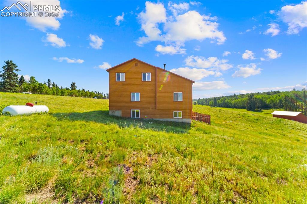 428 Ridge Drive Divide, CO 80814 - Photo 39 of 49 a view of a garden with a house in the background