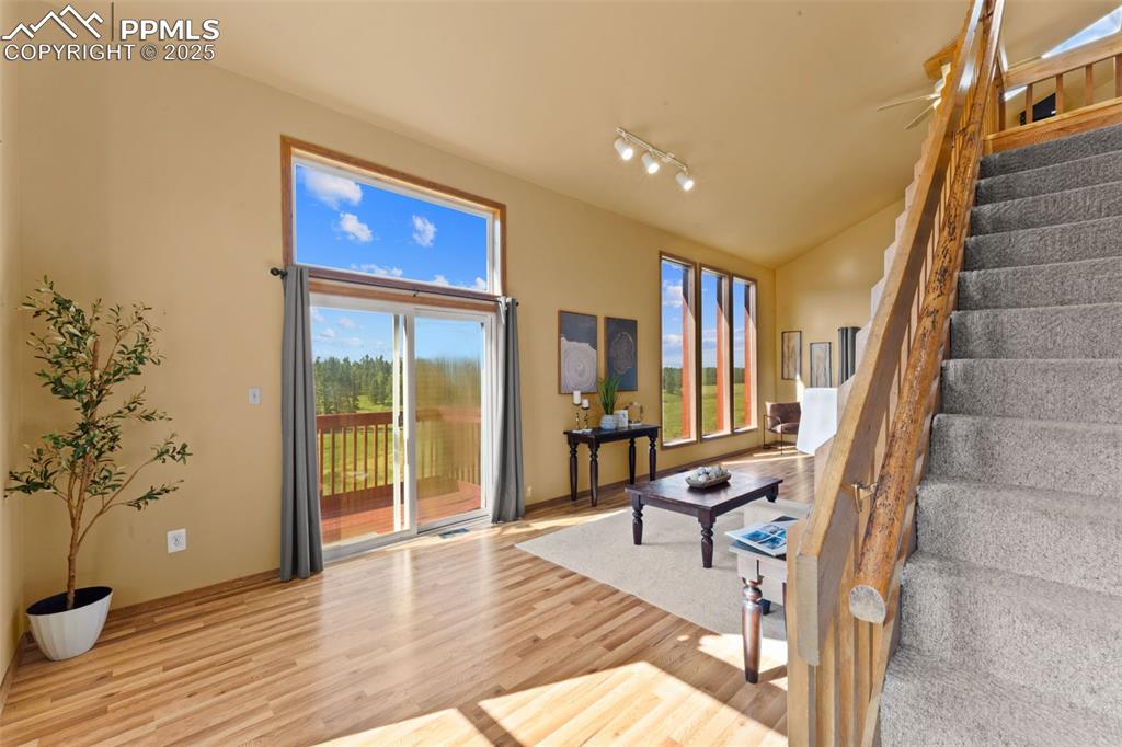 428 Ridge Drive Divide, CO 80814 - Photo 9 of 49 a view of a hallway with wooden floor and furniture