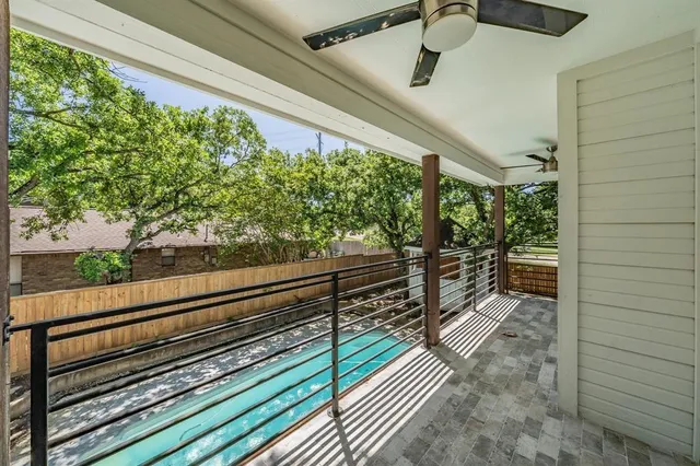 a view of a back yard from a balcony