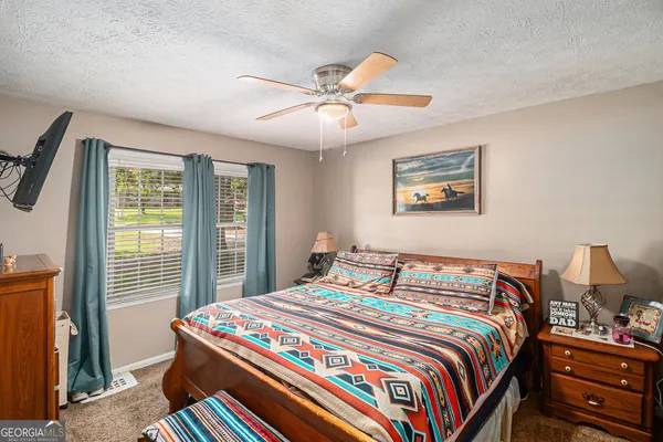 a bathroom with a shower toilet and sink