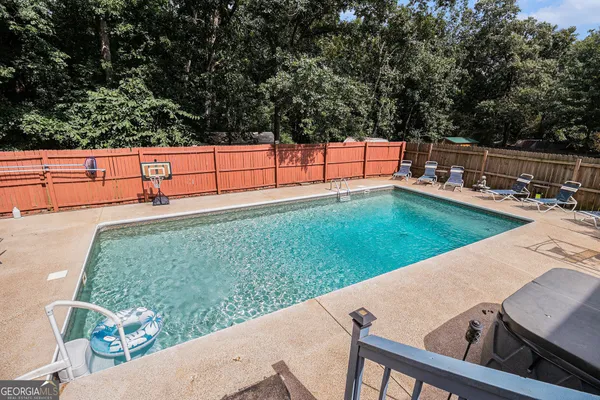 a view of a house with a backyard and porch