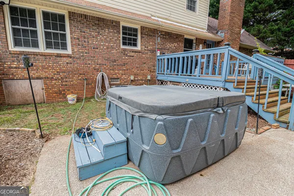 a view of a house with swimming pool and sitting area
