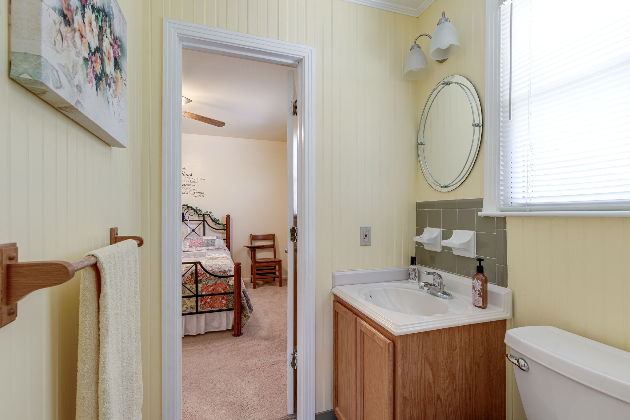 417 Cedarcliff Road Antioch, TN 37013 - Photo 12 of 25 a bathroom with a sink a mirror and a toilet