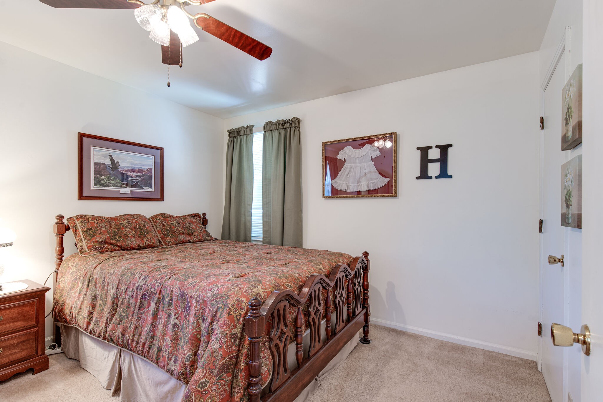 417 Cedarcliff Road Antioch, TN 37013 - Photo 14 of 25 a bedroom with a large bed and a chandelier