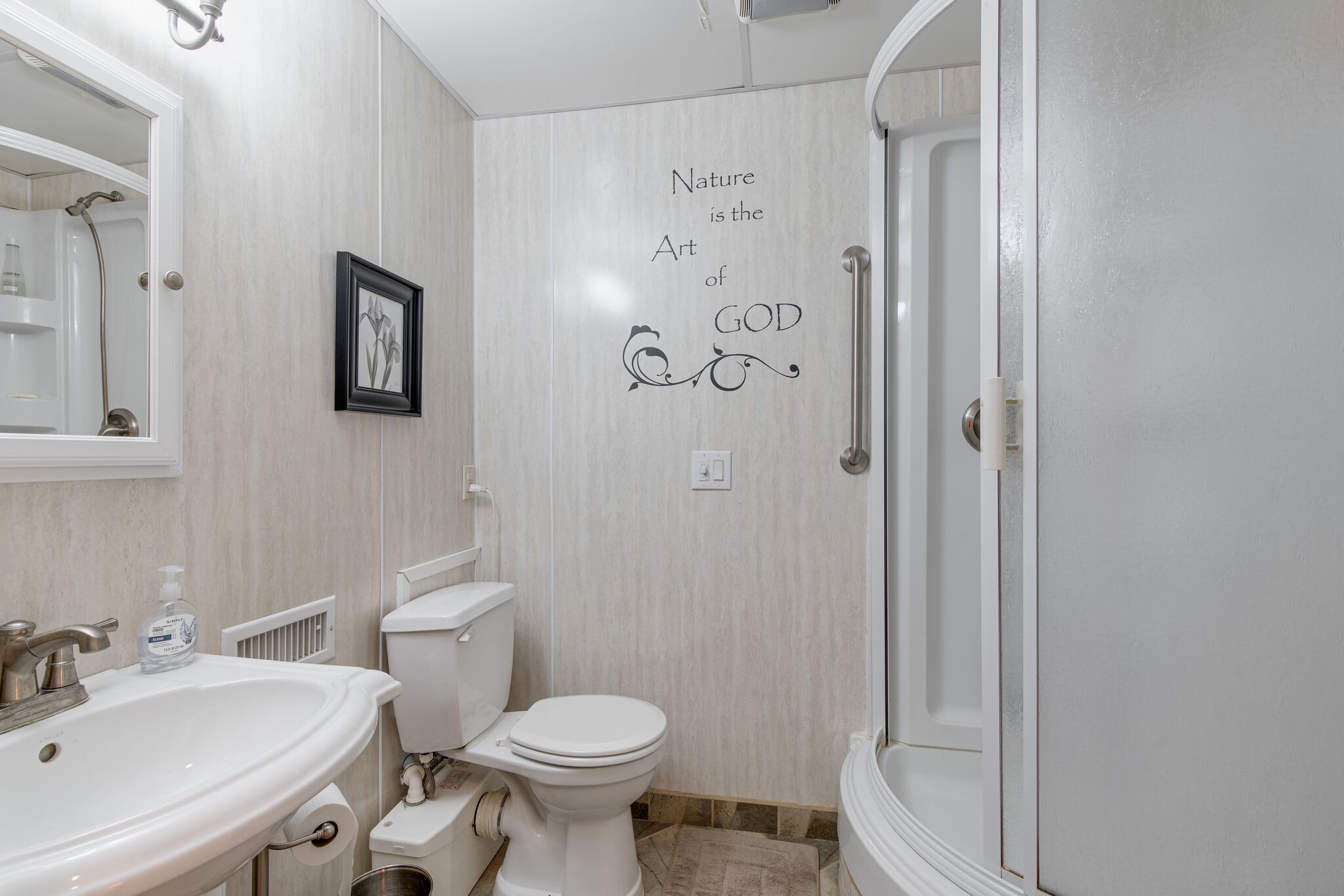 417 Cedarcliff Road Antioch, TN 37013 - Photo 18 of 25 a white toilet sitting next to a bathroom sink