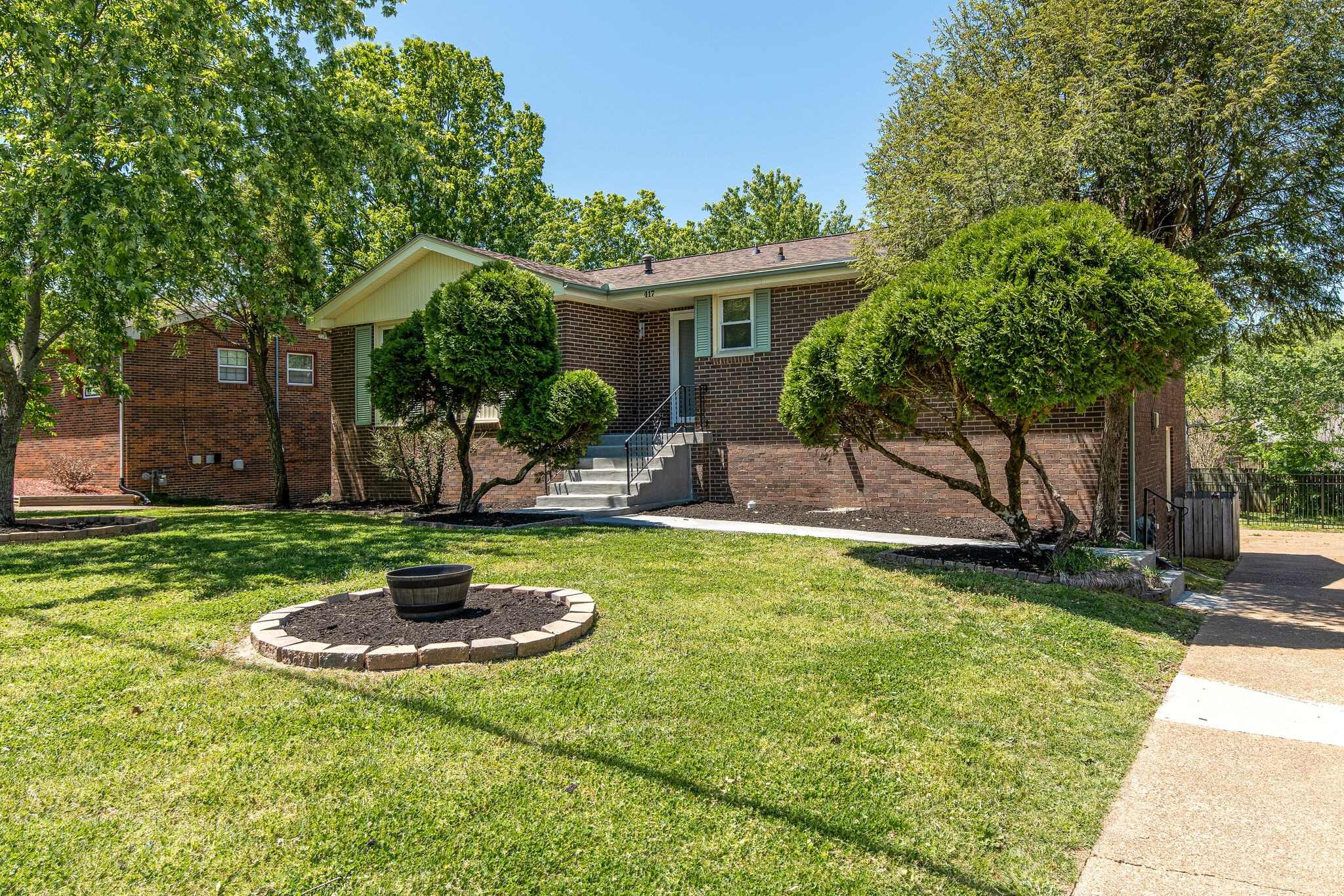 417 Cedarcliff Road Antioch, TN 37013 - Photo 2 of 25 a swimming pool with wooden fence