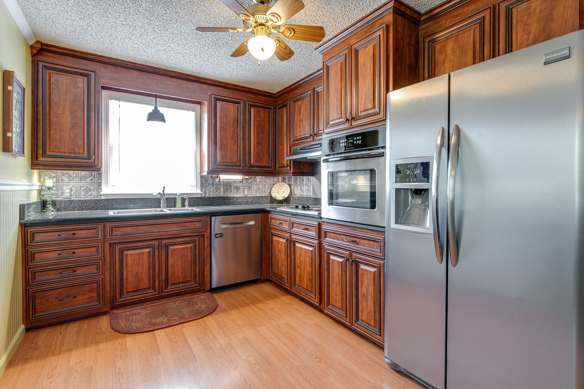 417 Cedarcliff Road Antioch, TN 37013 - Photo 6 of 25 a kitchen with stainless steel appliances granite countertop a refrigerator and a sink