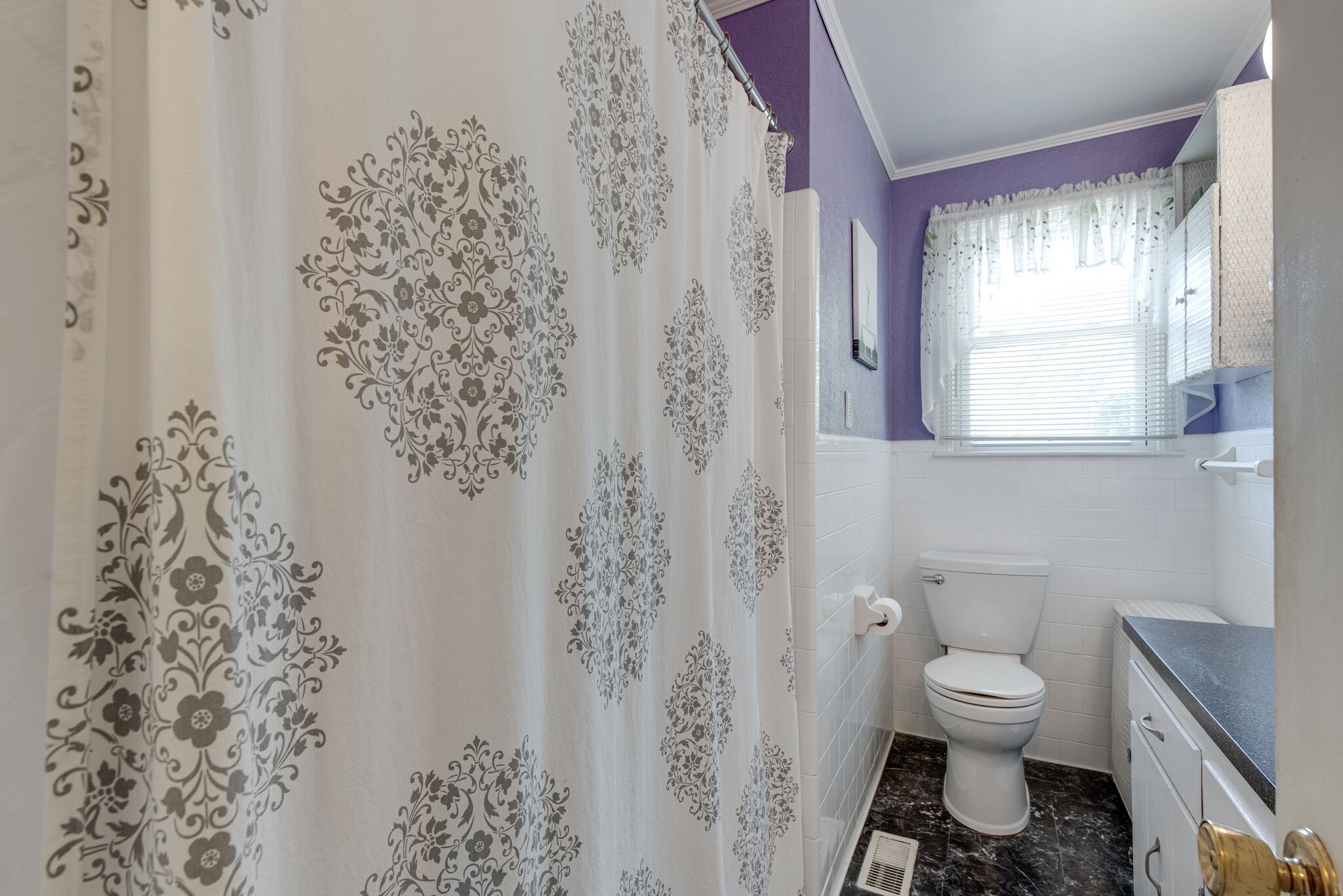 417 Cedarcliff Road Antioch, TN 37013 - Photo 9 of 25 a bathroom with a toilet a sink and a window
