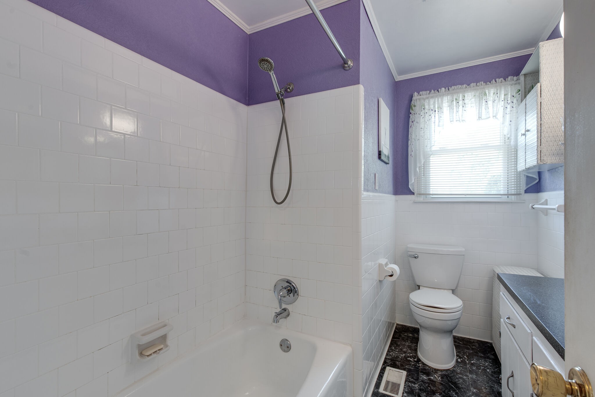 417 Cedarcliff Road Antioch, TN 37013 - Photo 10 of 25 a bathroom with a granite countertop toilet a sink and a bathtub
