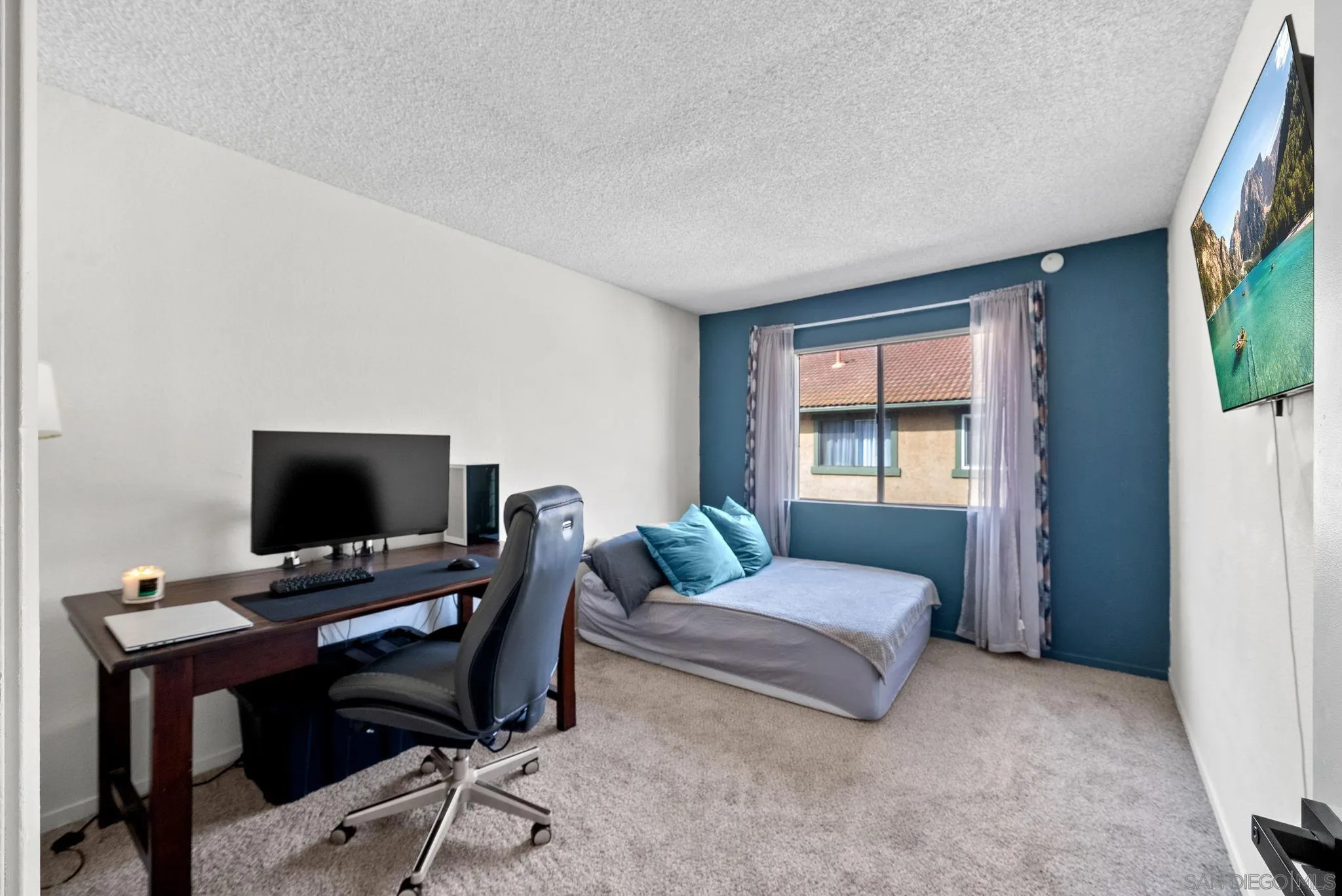 10790 Riderwood Terrace, Unit B Santee, CA 92071 - Photo 11 of 24 a bedroom with a bed and a window