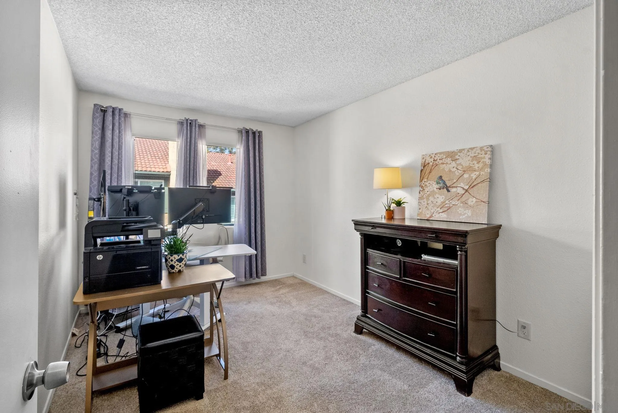 10790 Riderwood Terrace, Unit B Santee, CA 92071 - Photo 12 of 24 a bedroom with furniture and a window