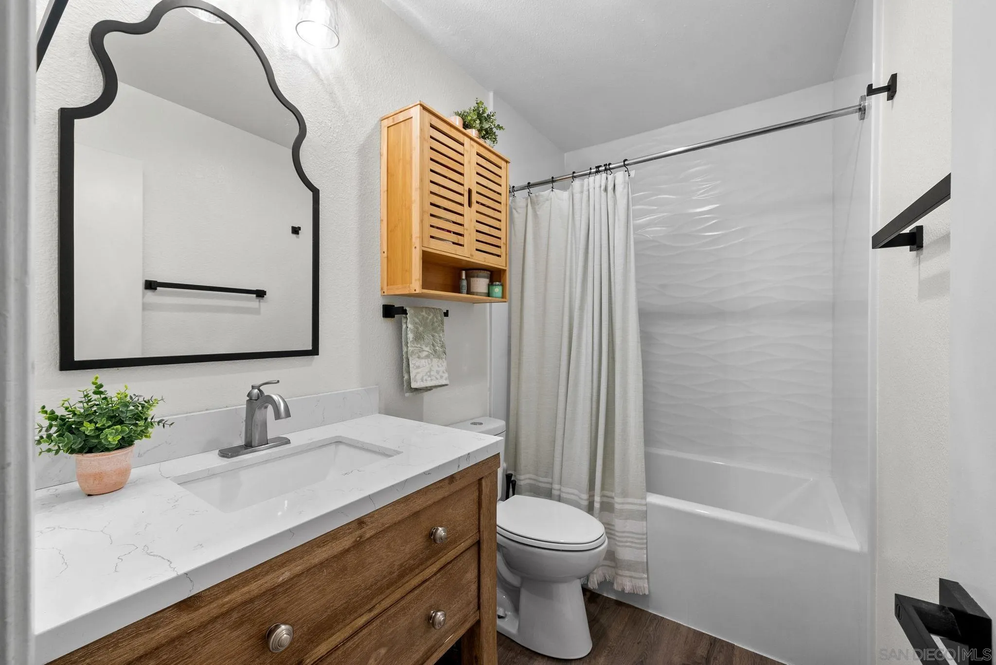 10790 Riderwood Terrace, Unit B Santee, CA 92071 - Photo 14 of 24 a bathroom with a sink a toilet and shower
