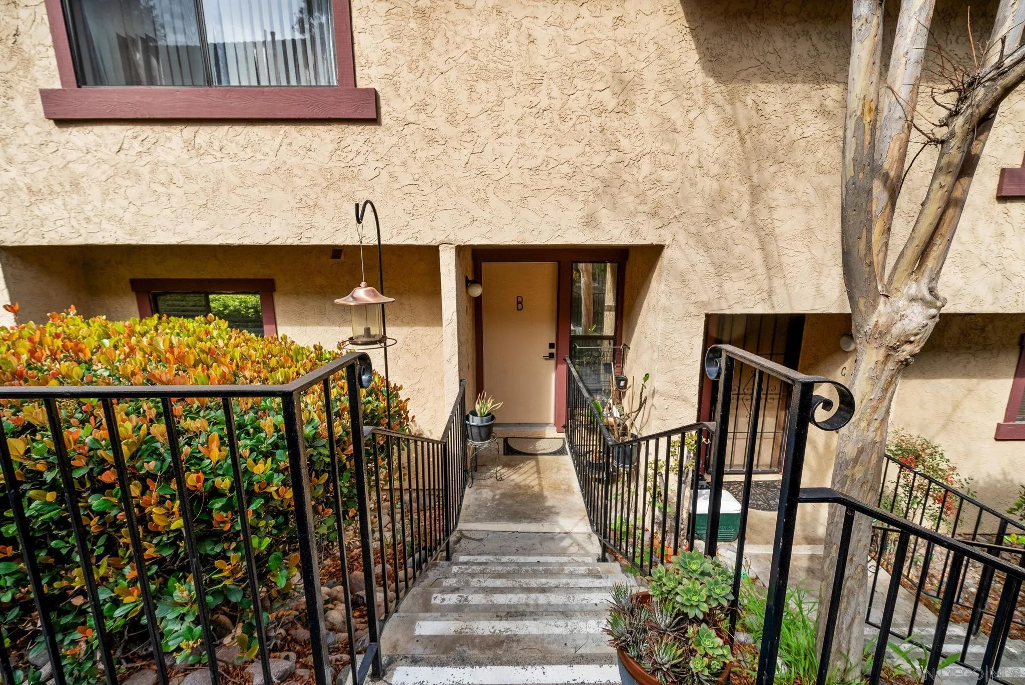 10790 Riderwood Terrace, Unit B Santee, CA 92071 - Photo 19 of 24 a view of a balcony with wooden floor and stairs