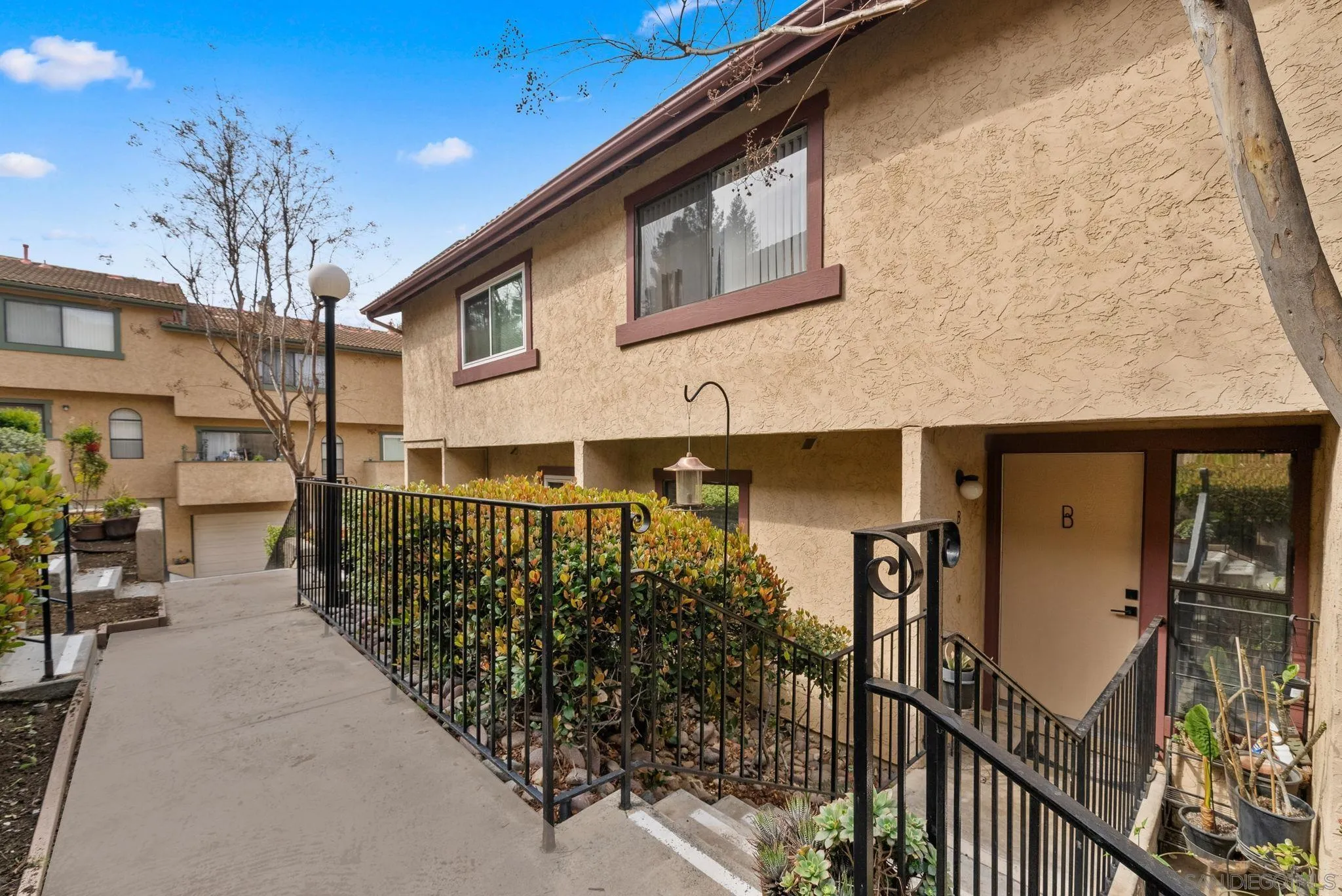 10790 Riderwood Terrace, Unit B Santee, CA 92071 - Photo 22 of 24 a view of a house with wooden fence