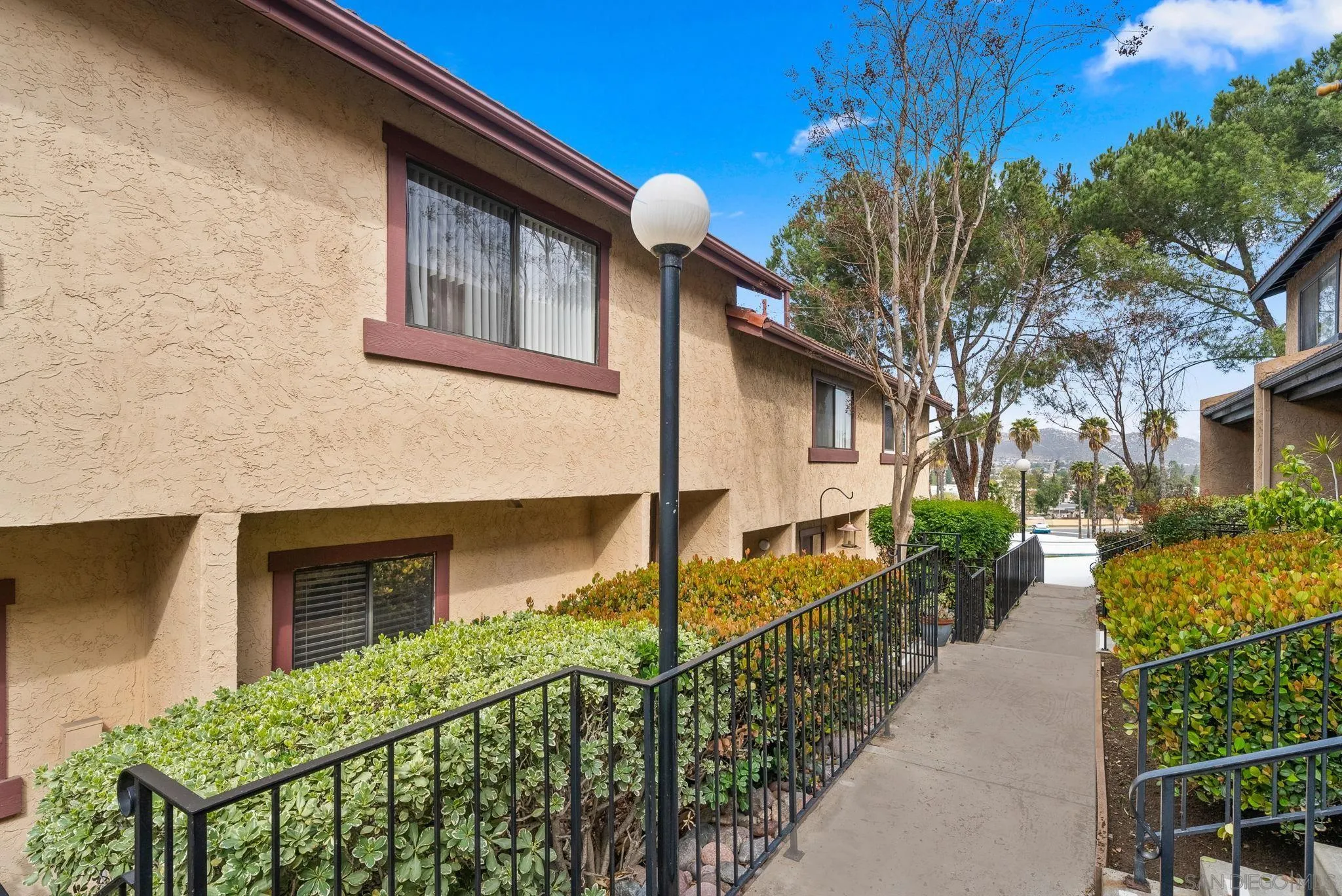 10790 Riderwood Terrace, Unit B Santee, CA 92071 - Photo 23 of 24 a front view of a house with garden