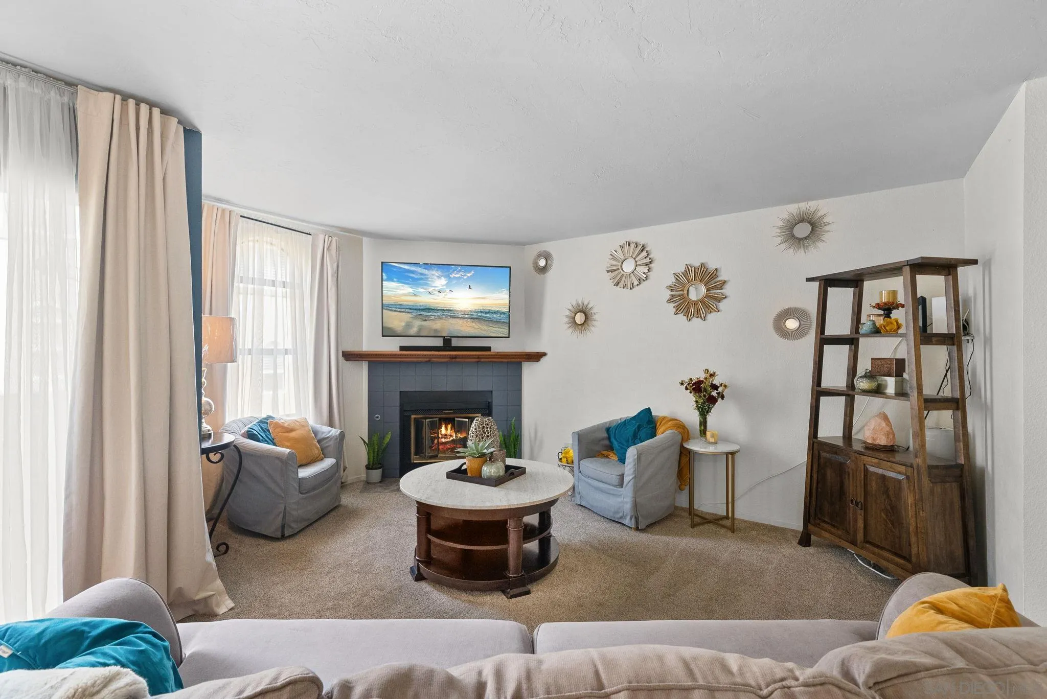 10790 Riderwood Terrace, Unit B Santee, CA 92071 - Photo 3 of 24 a living room with furniture and a fireplace