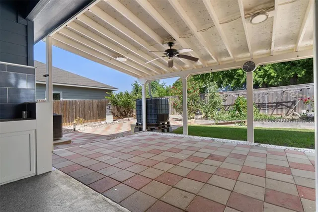 a view of a house with backyard and a garden