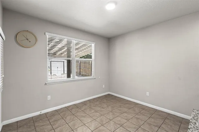 a kitchen with granite countertop a sink and a wooden floor