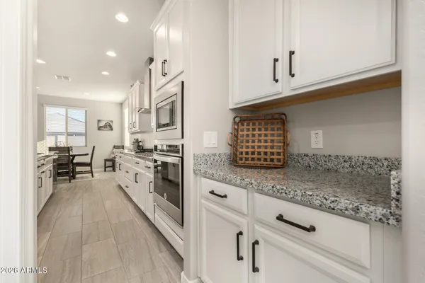 a kitchen with center island table and chairs in it