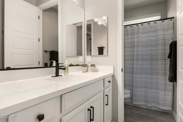 a bedroom with two beds and a window